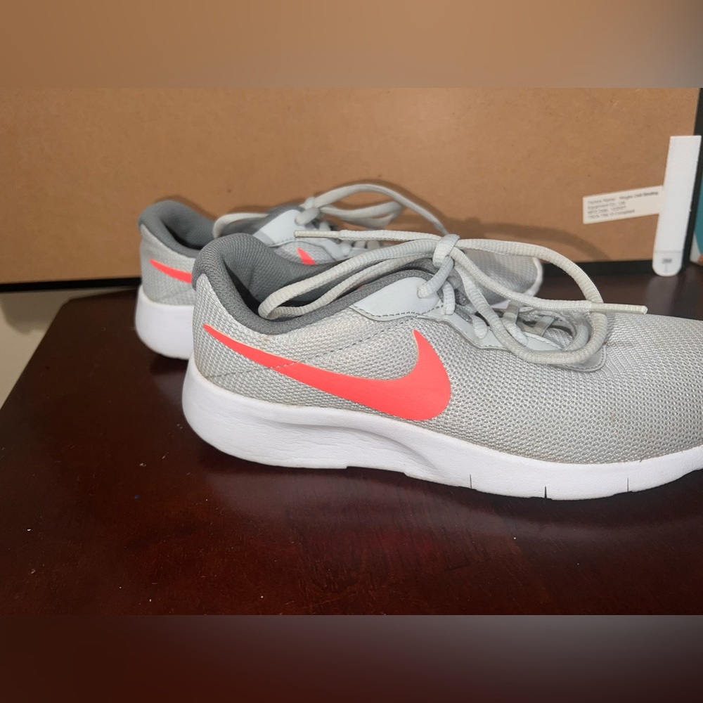Nike light gray and orange swoop